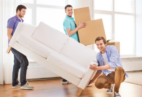Office furniture and equipment being moved in Brent