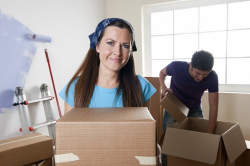 Moving team preparing items for transport near Brent properties